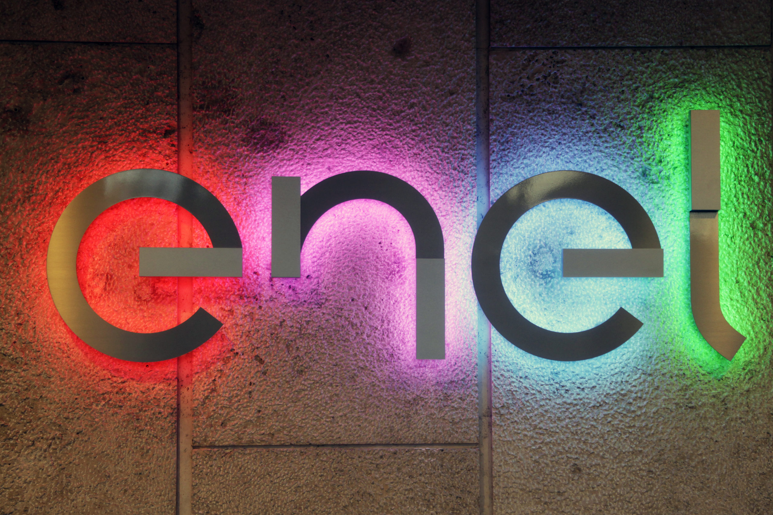 Enerby company Enel's logo lit with coloured lights